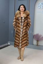 Load image into Gallery viewer, Full length muskrat fur hooded coat with racoon trim