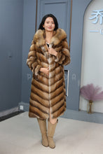 Load image into Gallery viewer, Full length muskrat fur hooded coat with racoon trim