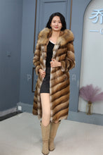 Load image into Gallery viewer, Full length muskrat fur hooded coat with racoon trim