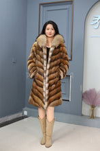 Load image into Gallery viewer, Full length muskrat fur hooded coat with racoon trim