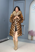 Load image into Gallery viewer, Full length muskrat fur hooded coat with racoon trim