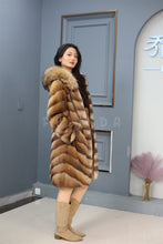 Load image into Gallery viewer, Full length muskrat fur hooded coat with racoon trim